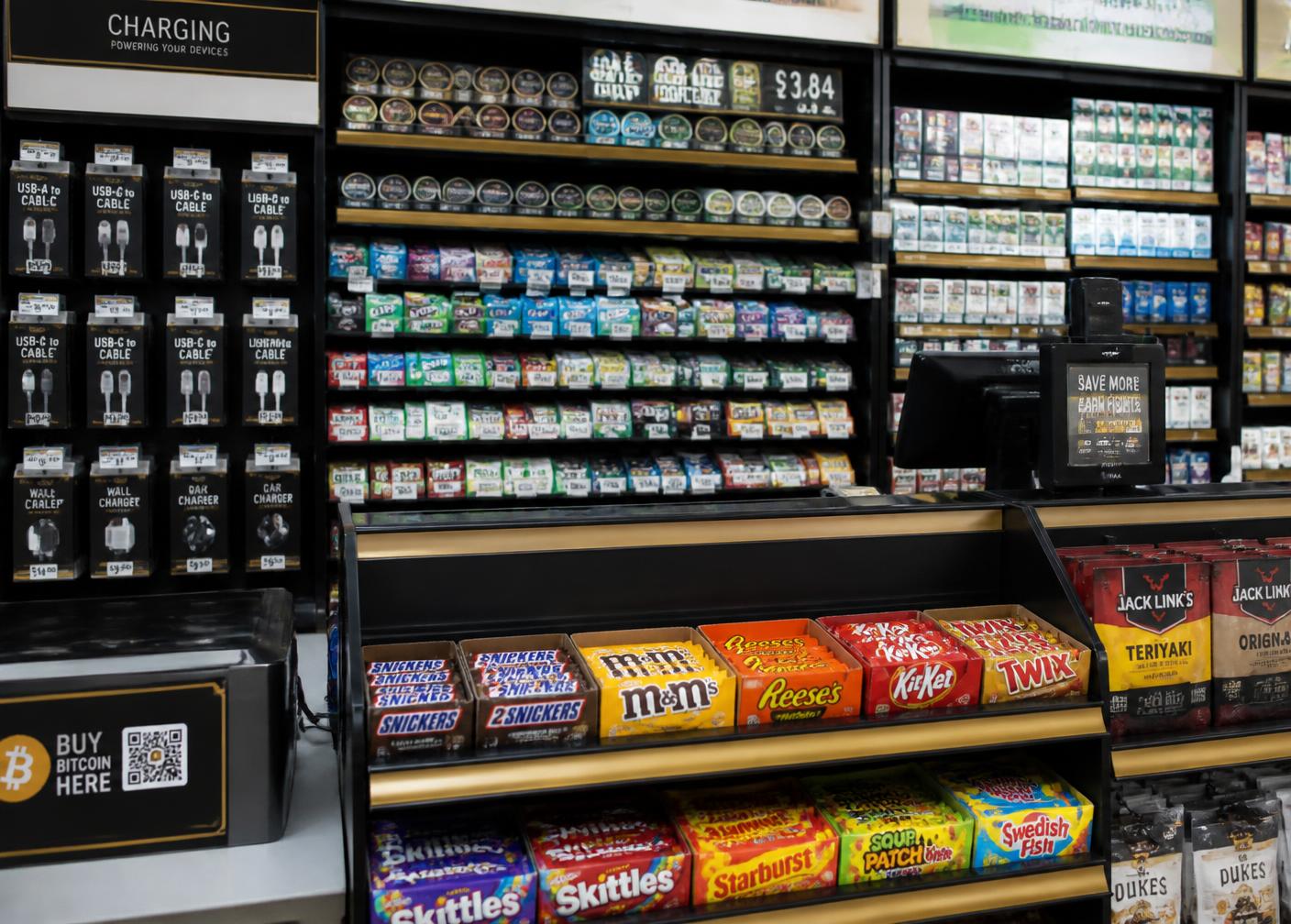 Well-merchandised convenience store shelves and counter display